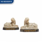 A PAIR OF ITALIAN BAROQUE MARBLE LIONS