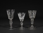 A DUTCH-ENGRAVED 'CONFINEMENT' GLASS, A DUTCH-ENGRAVED ARMORIAL WINE GLASS, AND A GERMAN OR BOHEMIAN ENGRAVED WINE GLASS | 18TH CENTURY