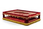 A RED VELVET AND VELVET APPLIQUÉ BANQUETTE INCORPORATING A LOUIS XIV PANEL, DESIGNED BY JACQUES GARCIA, THE PANEL EARLY 18TH CENTURY