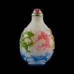 A five-colour overlay snowflake glass 'chilong' snuff bottle Qing dynasty, 18th - 19th century | 清十八至十九世紀 雪霏地套五色料螭龍紋鼻煙壺