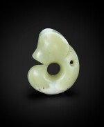 A rare and subtly carved celadon jade 'pig-dragon', zhulong Neolithic period, Hongshan culture | 新石器時代 紅山文化青白玉豬龍