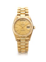 ROLEX | REF 18038 DAY-DATE, A YELLOW GOLD AUTOMATIC CENTER SECONDS WRISTWATCH WITH DAY DATE AND BRACELET CIRCA 1984