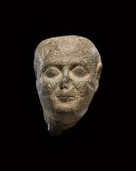 An Egyptian Basalt Head of a Man, 30th Dynasty/Ptolemaic Period, 380-30 B.C.