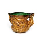 An amber- and green-glazed pottery cup, Tang dynasty | 唐 三彩模印樹樁式小盃