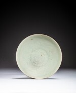 A carved Qingbai bowl, Song dynasty | 宋 青白釉刻花卉紋盌