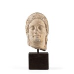A Cypriote Limestone Veiled Head of a Woman, 5th/4th Century B.C. | Tête voilée de femme en calcaire, art chypriote, Ve/IVe siècle avant J.-C.