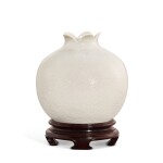A soft-paste white porcelain carved 'pomegranate' waterpot, Qing dynasty, Qianlong period 清乾隆 漿胎白瓷刻鳳紋石榴尊