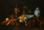 A 'pronk' still life with a lobster, bread, lemons, grapes and apricots alongside a gilt cup, tazza and an imported Chinese dish and jar