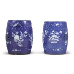 A pair of slip-decorated blue ground barrel-form garden stools, 19th / 20th century