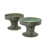 A pair of archaic bronze ritual food vessels, pu, Late Western Zhou dynasty 西周末 青銅鏤空龍紋鋪一對