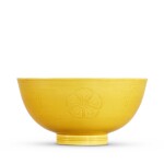 A yellow-glazed incised 'floral' bowl, Seal mark and period of Qianlong  清乾隆 黃釉暗刻花卉紋盌  《大清乾隆年製》款