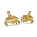 A pair of Régence style gilt-bronze chenets, late 19th century