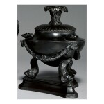 A WEDGWOOD AND BENTLEY BLACK BASALT FOOTED OIL LAMP AND CANDLE HOLDER CIRCA 1771-8 