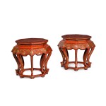 A pair of Chinese red lacquer octagonal urn stands