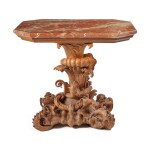 A German Rococo Stand carved with dragons, shellwork and a cornucopia
