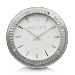 INDUCTA MANUFACTURE FOR ROLEX | A METALWORK WALL CLOCK, CIRCA 2010