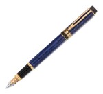 WATERMAN | A LAPIS BLUE MARBLED RESIN FOUNTAIN PEN WITH GOLD ACCENTS, CIRCA 1990