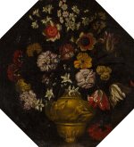 Octagonal still life of flowers in a decorative vase embellished with a Nereid and Triton