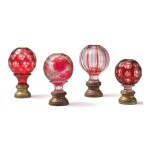 FOUR BRASS-MOUNTED RUBY FLASHED GLASS NEWEL POST FINIALS, LATE 19TH/EARLY 20TH CENTURY