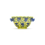 A fine and rare Ming-style yellow-ground and underglaze-blue handled cup, Mark and period of Yongzheng | 清雍正 黄地青花仙芝花卉紋雙耳盃 《大清雍正年製》款