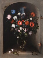 Still life of flowers with an iris in a glass vase, placed in a niche