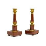 A pair of Russian gilt-bronze and red lazulite candle holders