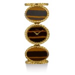PIAGET | REFERENCE 9803 D 63, A YELLOW GOLD BRACELET WATCH WITH TIGER'S EYE DIAL, CIRCA 1970
