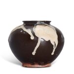 A phosphatic-splashed jar, Tang dynasty 唐 黑釉彩斑罐