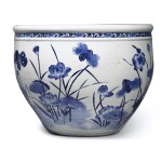 A large blue and white 'lotus pond' jardinière, Qing dynasty, 18th century | 清十八世紀 青花浮雕路路連科圖大缸