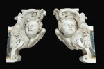 Pair of scrolls decorated with angel's heads