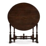 A Queen Anne walnut 'coaching table', the base first quarter 18th century, the top later
