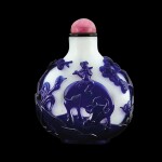 A purple-blue overlay white glass 'herdboy and fisherman' snuff bottle, Qing dynasty, 19th century | 清十九世紀 涅白地套藍料漁牧圖鼻煙壺