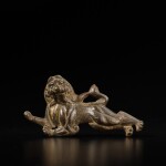 A parcel-gilt bronze plaque of a leaping lion, Tang dynasty
