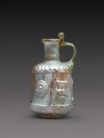 A Roman Pale Green Mould-Blown Glass Flask, circa 1st century A.D.