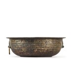 A gilt and silvered bronze 'dragon' basin, Western Han dynasty | 西漢 鎏金銅銀弦紋鋪首活環耳洗