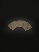 An archaic celadon jade 'mythical beast' pendant (Huang),  Western Zhou dynasty | 西周 青玉人首龍身紋璜