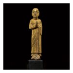A SMALL GILT-BRONZE FIGURE OF ANANDA, TANG DYNASTY