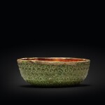 A molded amber- and green-glazed pottery bowl, Tang dynasty | 唐 三彩模印小盌