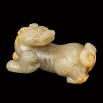 A greyish-celadon jade figure of a mythical beast Ming dynasty | 明 灰青玉瑞獸