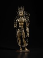 A large silver-inlaid copper alloy figure of Avalokiteshvara, Western Tibet, 11th century | 藏西 十一世紀 銅合金錯銀銅觀音立像