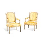 A pair of Louis XVI style grey-painted and parcel-gilt fauteuils | Paire de fauteuils en bois peint et doré de style Louis XVI