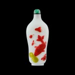 A three-colour overlay white glass 'fish' snuff bottle Qing dynasty, 18th century | 清十八世紀 涅白地套三色料年年有餘鼻煙壺
