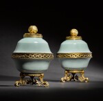 A pair of early Louis XV gilt-bronze and gilt-metal-mounted Chinese celadon-ground pot-pourri bowls and covers, the porcelain Qianlong mark and period