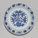 A blue and white 'peach' dish Ming dynasty, 16th century | 明十六世紀 青花桃紋折沿盤