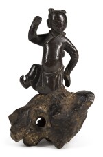 A BRONZE FIGURE OF A BOY DANCING ON A ROCK | 17TH/18TH CENTURY | 十七/十八世紀 銅童子擺件