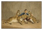 A man sitting with a lioness and her two cubs