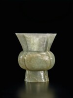 A celadon jade 'three friends of winter' gu-form beaker vase, Ming dynasty, with Qianlong period imperial inscription | 明  乾隆時期刻御題詩 青玉刻歲寒三友圖海棠式花觚
