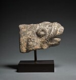 A Granite Feline Head Terminal from a Trapezophoros (Table Leg), Roman Egypt, circa 2nd Century A.D.