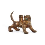 A small gilt-bronze 'lion' support, Tang dynasty 唐 銅鎏金獅形座