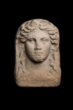 An Etruscan Terracotta relief head of a Woman, circa 4th Century B.C.